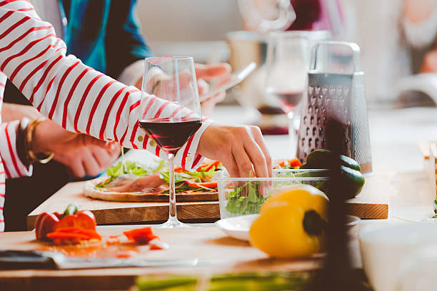 istock Couple preparing pizza, close up of hands 496266090