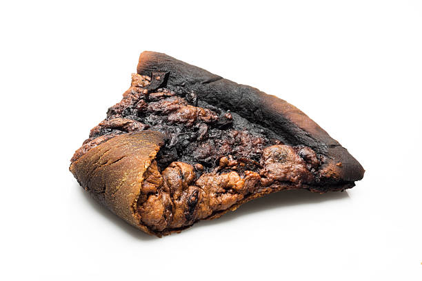 burnt-slice-of-pizza-on-white-background