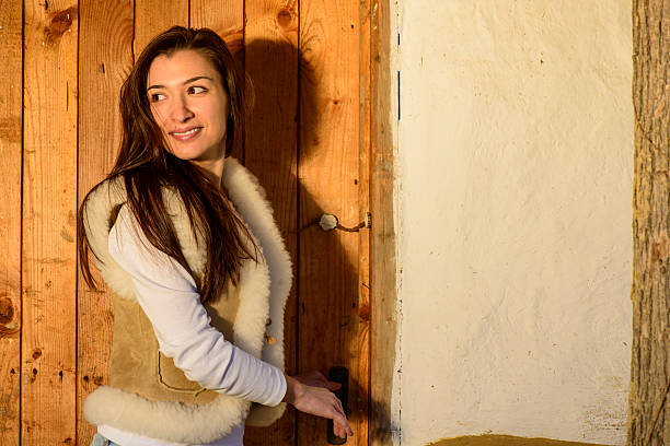 istock Young woman opening clossed door 496266295