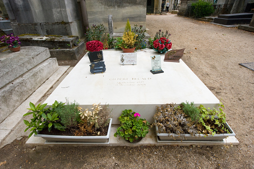 Paris, France - July 27, 2015: Grave of singer and star Gilbert Becaud on cemetery Pere Lachaise in Paris in France. 