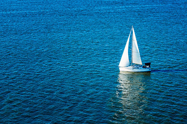 high angle view of anchored sailboat, lots of copy space