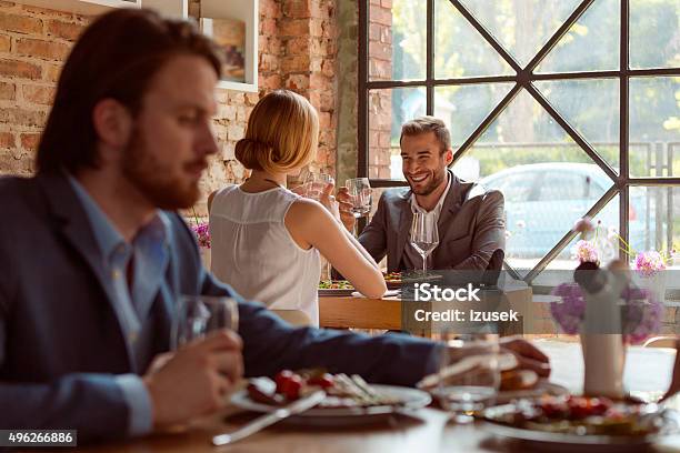 Business Colleagues Enjoying Lunch In The Restaurant Stock Photo - Download Image Now