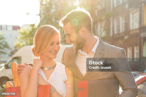 Affectionate Couple Talking On The Street Stock Photo - Download Image Now - 2015, Adult, Adults Only