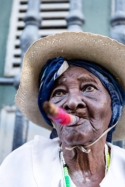 istock African cuban woman smoking cigar 496279502