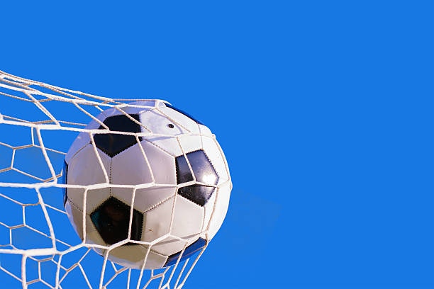 istock soccer ball hit the net,success goal concept 496279544