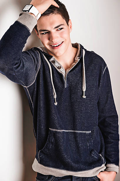 istock Smart young fashion model posing in gray sweatshirt 496280890