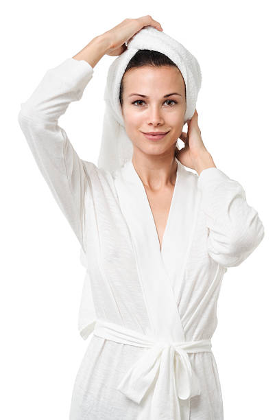 istock Young Woman in bathrobe on white 496280924