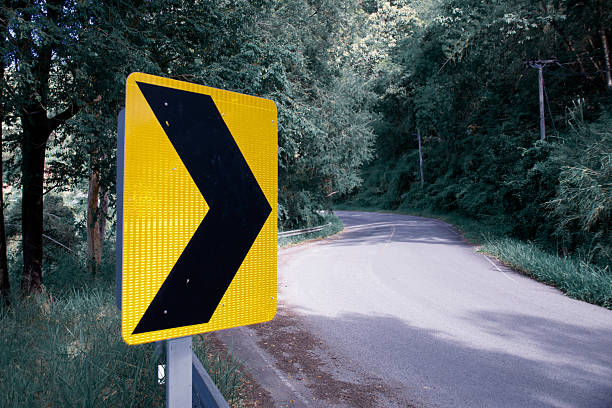 istock Yellow black Arrow sign banner on the road 496281880