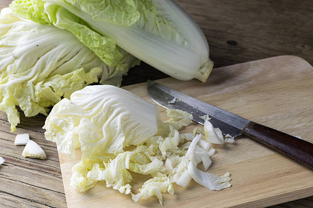 istock chopped chinese cabbage on wooden cutting board 496282776