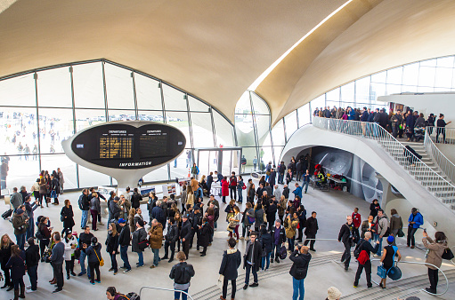 New York City, New York, USA - October 18, 2015: View of crowd at the historic  TWA Flight Center airport terminal at John F. Kennedy International Airport during the 2015 OHNY event.  OHNY is an annual event that allows visitors access to historic buildings such as this that are typically closed to visitors. The TWA terminal at JFK closed for business in 2001. 
