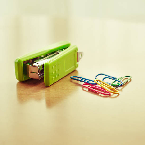 istock Green stapler and paper clip 496287674
