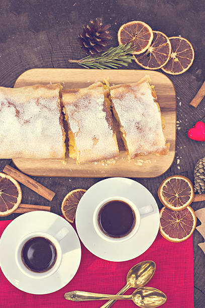 istock Strudel with custard and orange. Christmas Stollen. Christmas table decoration. 496287806
