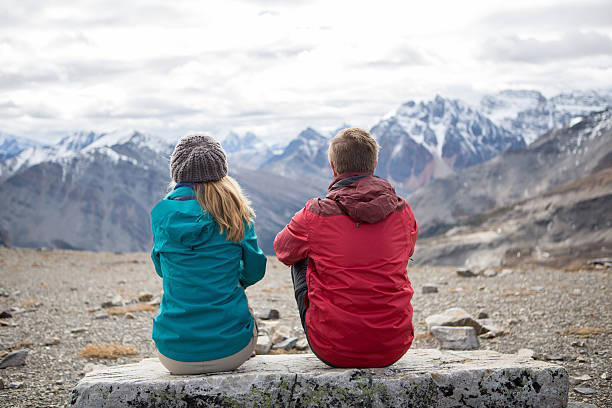 istock Two hikers on mountain top enjoying landscape 496288302