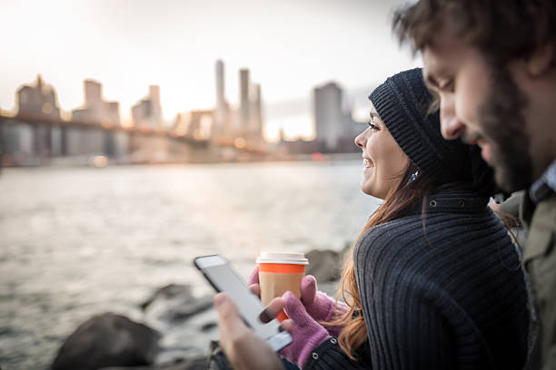 Young Couple Enjoying Sunset at Brooklyn Bridge, NYC