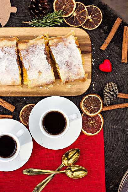istock Strudel with custard and orange. Christmas Stollen. Christmas table decoration. 496289400