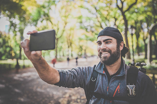 istock Man Taking a Selfie in Central Park, New York City 496289618
