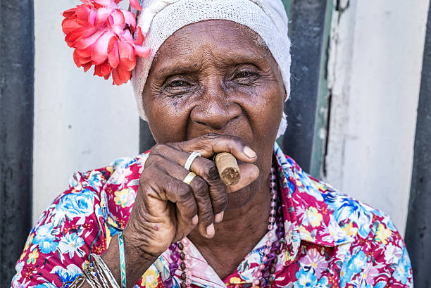 istock African cuban woman smoking cigar 496290754