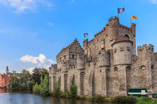 Ghent, Belgium - September 11, 2014: The Gravensteen is a medieval castle built in the twelfth century to become the seat of the Counts of Flanders. Over the centuries it housed a courthouse and a prison, then decayed until the 1885, when the city of Ghent bought and renovated it. Now it can be visited, and admire the city from above.
