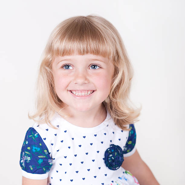 istock Lovely little girl smiling over white 496303605