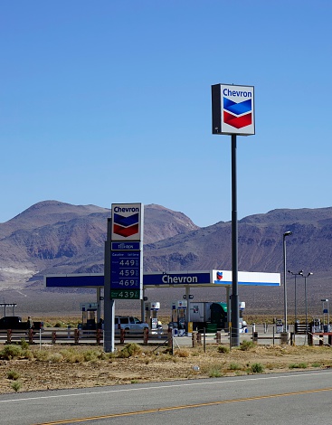Ridgecrest, California, USA - May 25, 2014: People at a Chevron gas station in Ridgecrest. Chevron is an American energy company with operations in over 180 countries.