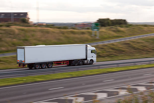 istock industrial lorry on motorway with motion blur 496306191