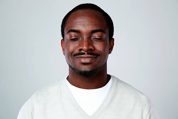 istock happy african man with closed eyes 496306723