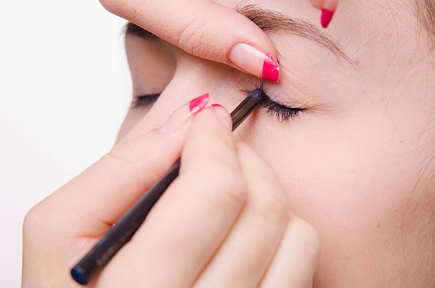 istock Makeup artist brings pencil eyelashes girl 496307343