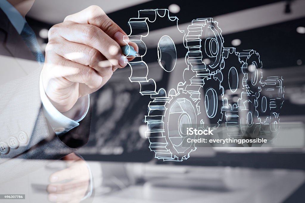 Empresario la mano de premios al concepto de éxito engranajes - Foto de stock de Mecánico libre de derechos Empresario la mano de premios al concepto de éxito engranajes - Foto de stock de Mecánico libre de derechos