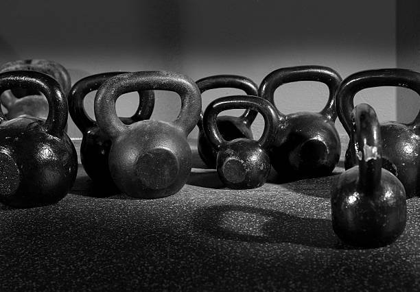 istock Kettlebells weights in a workout gym 496308877