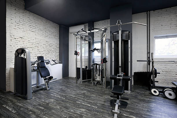 istock Exercise equipment in a gym 496309219