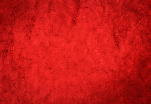 istock Bright red background from organic handmade paper with fiber texture 496309248