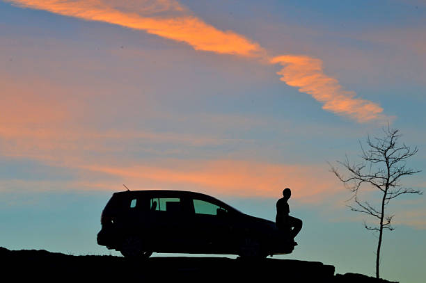 istock Silhouette of Man Watching a Sunset 496309414