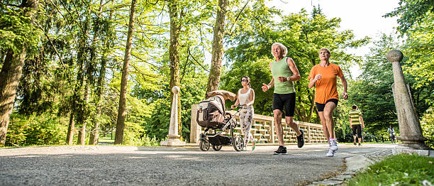 Senior couple jogging in park