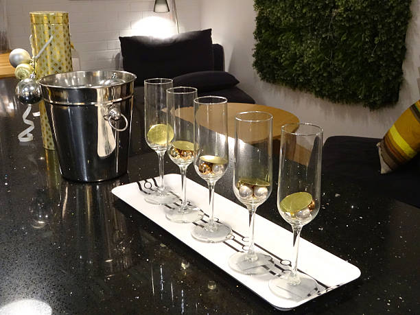 Image of five wine-glasses on tray with silver wine bucket