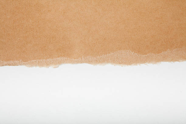 torn carboard paper torn cardboard paper, isolated. torn brown paper stock pictures, royalty-free photos & images