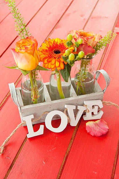 istock Fresh flowers in little bottles 496311426