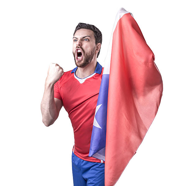 istock Chilean soccer player celebrates on white background 496312256