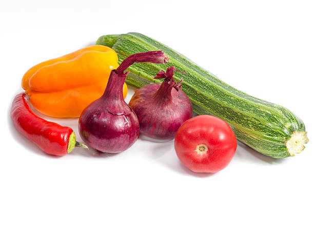 Stack of seasonal fresh vegetables on the white background