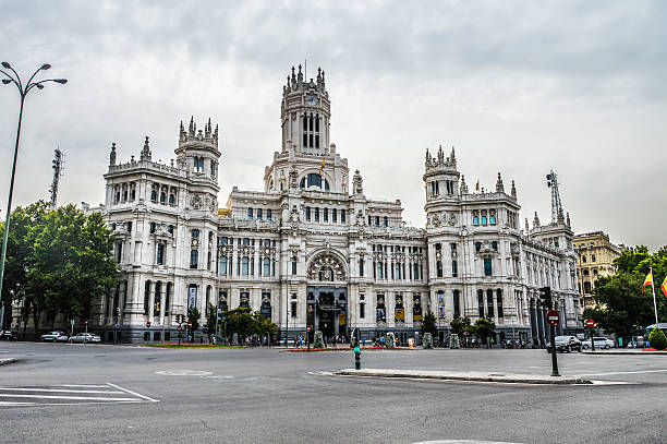 Madrid, Spain - August 8, 2015: Plaza de Cibeles. Photo taken during the day contains heavy vehicular and pedestrian traffic.