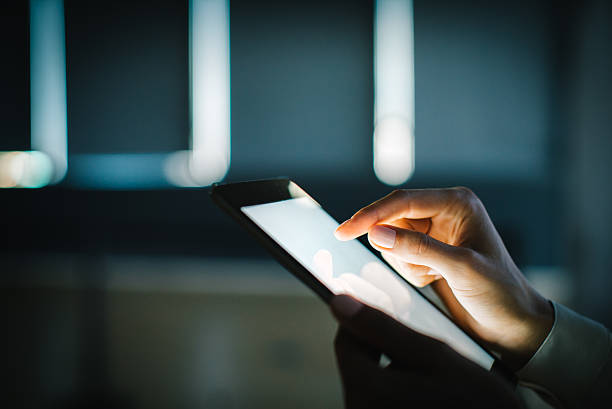 istock Blank tablet holding in female hands. Blurred background 496317236