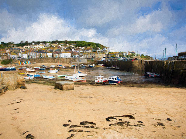 istock Sand and seaweed Mousehole harbour Cornwall England UK 496318386