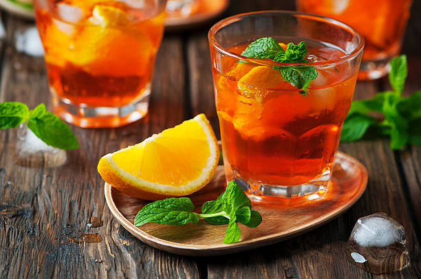 istock Glass of aperol with ice, orange and mint 496320616