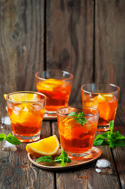 istock Glass of aperol with ice, orange and mint 496320648