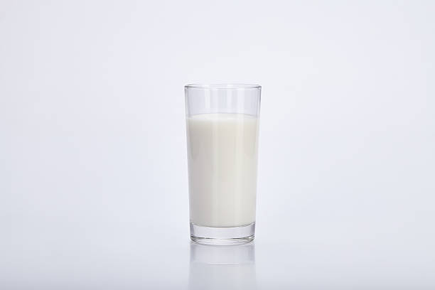 istock Glass cup with milk on a white background. 496321096