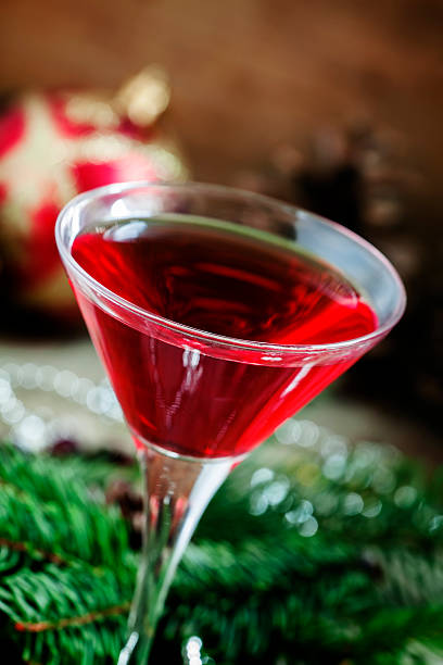 istock Red Christmas cocktail in a martini glass with fir branches 496321702