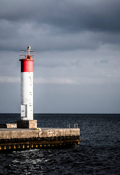 istock Lighthouse at the end of a Pier 496321822