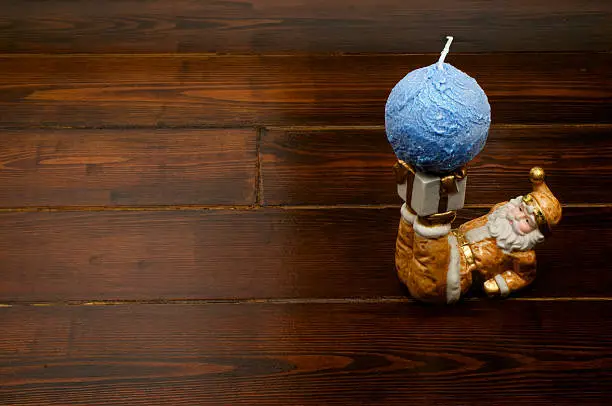 Candleholder in a shape of Santa Claus with blue ball-shaped candle