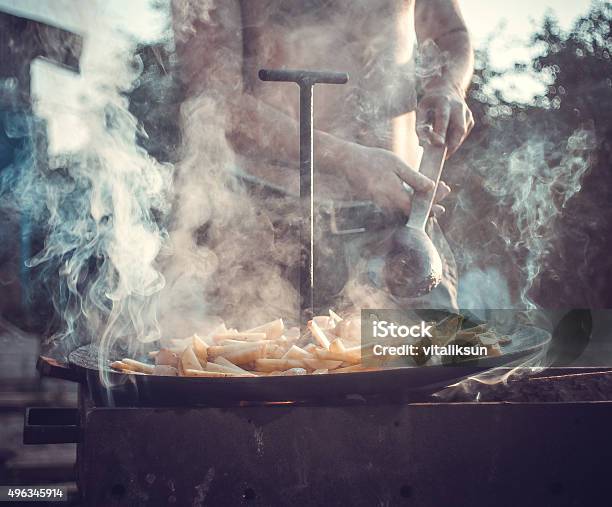 Man Preparing A Meal Stock Photo - Download Image Now - 2015, Activity, Adult