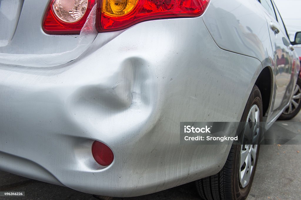 Car damaged A car has a dented rear bumper after an accident Car Stock Photo