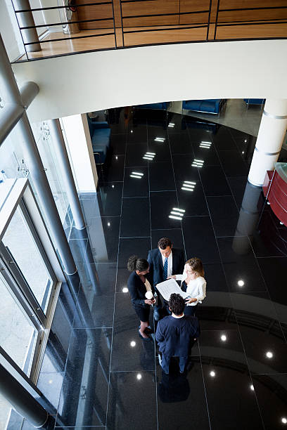 istock Top view of business executives reviewing documents 496348489